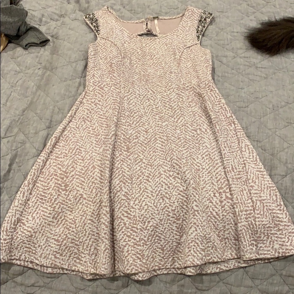 Adorable dress with attached jewels on sleeves